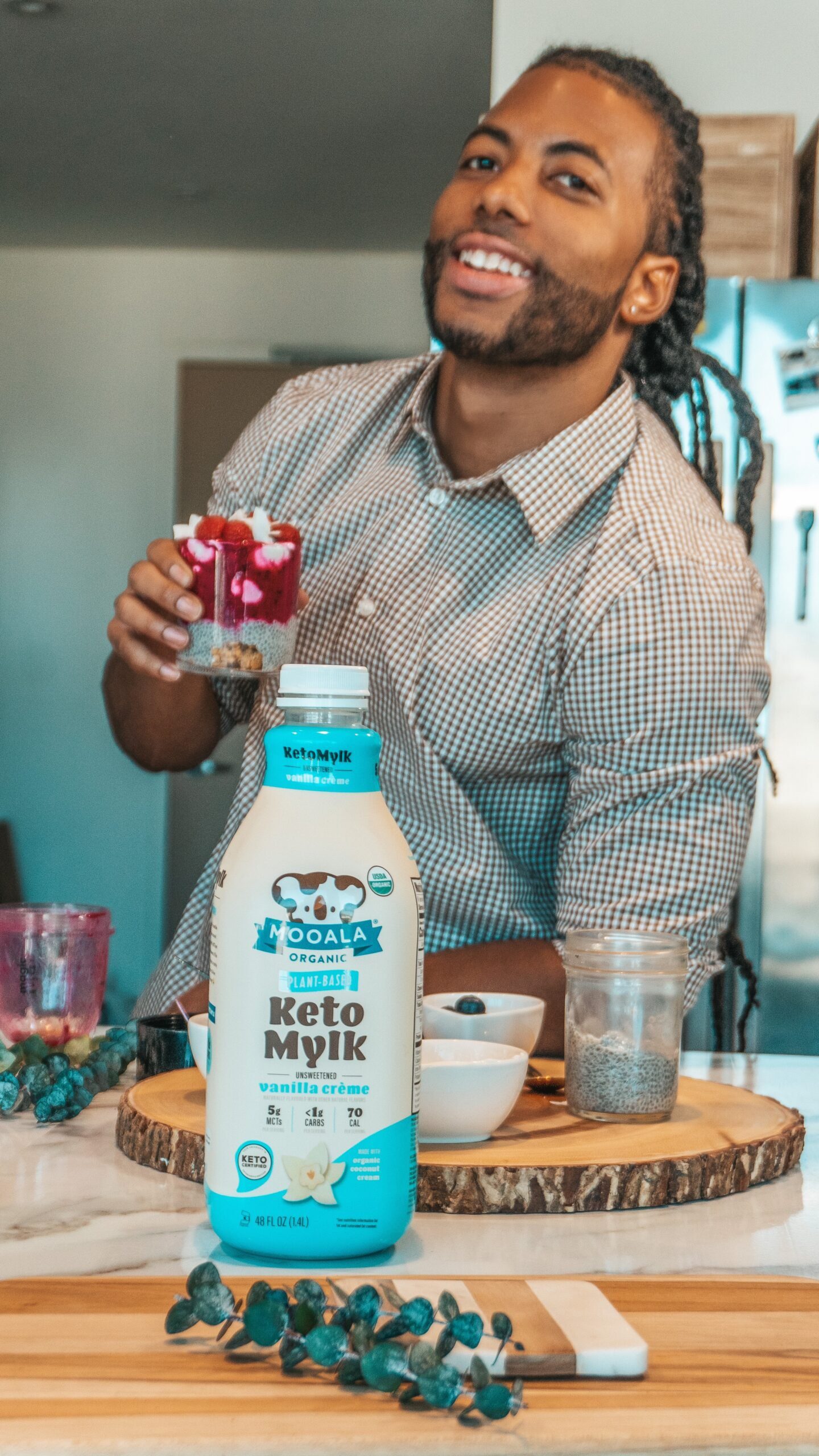 Chace Cauthen holding Mooala Keto Mylk Vanilla Creme Organic Plant Based Milk